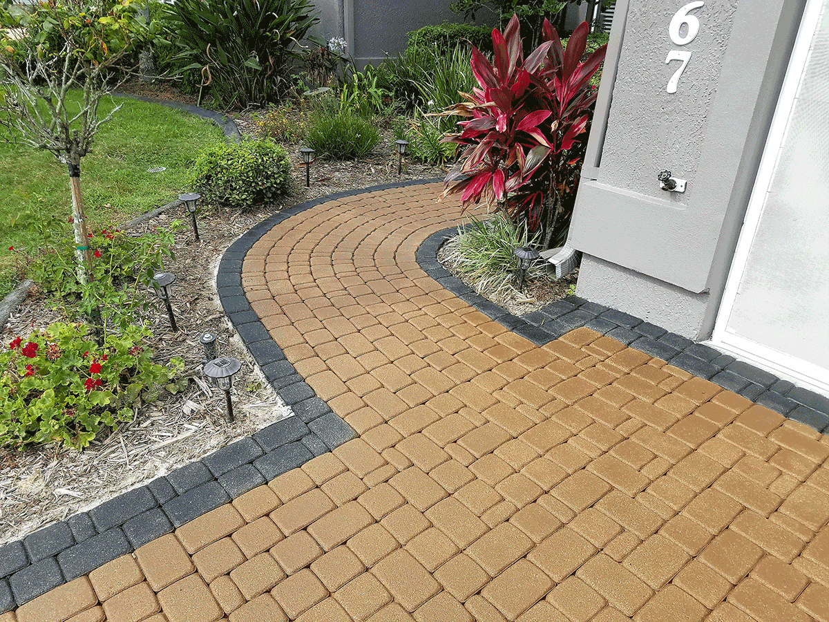 Paver driveway leading to the front door