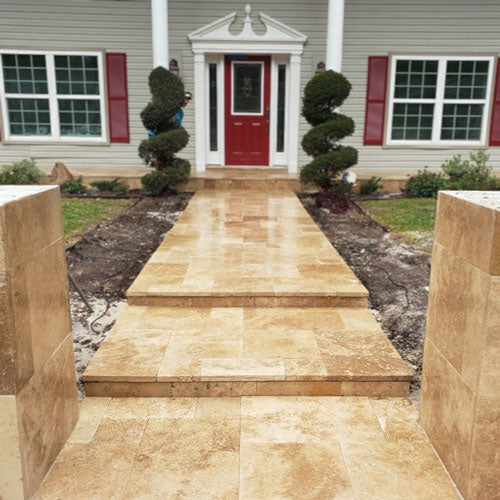 House with a newly installed stone walkway to the front door