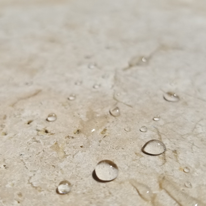Water droplets on a stone surface