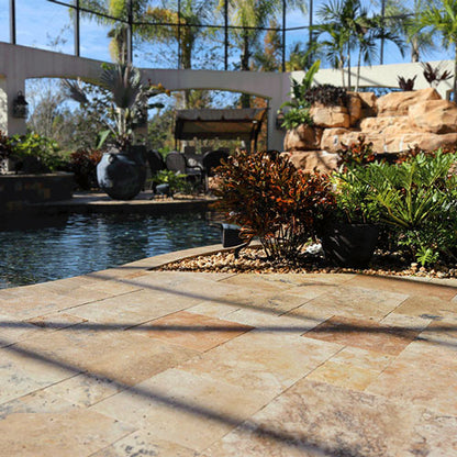 Beautiful pool deck with stone features and plants